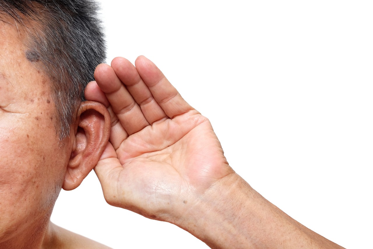 Old man paying attention to listening sound, Age-related hearing loss problem in elderly.
