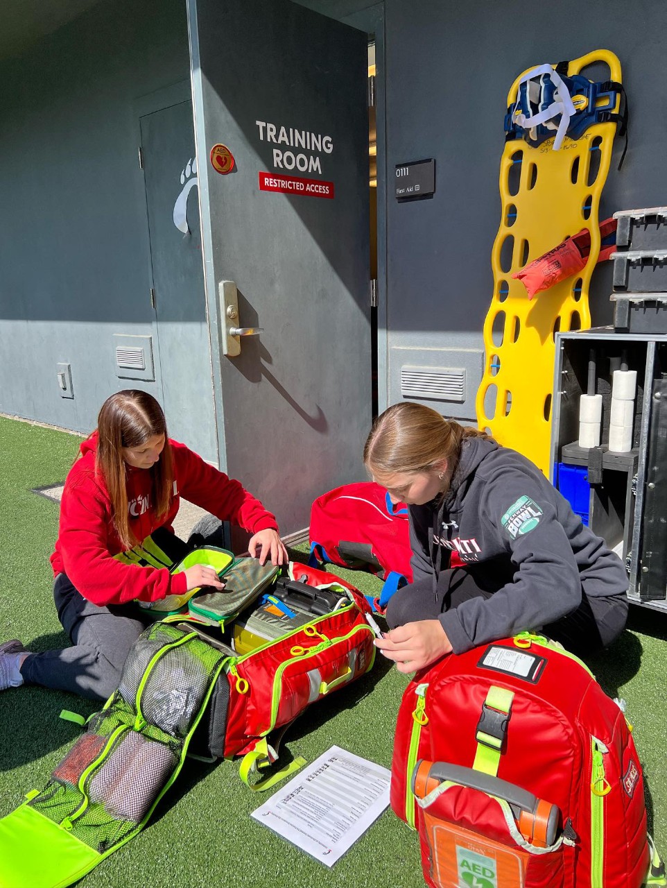 Students pack a medical emergency bag. 