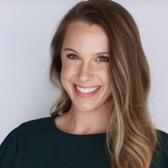 Brenden Benjamin, Second-year DTP student sits on top of a mountain.