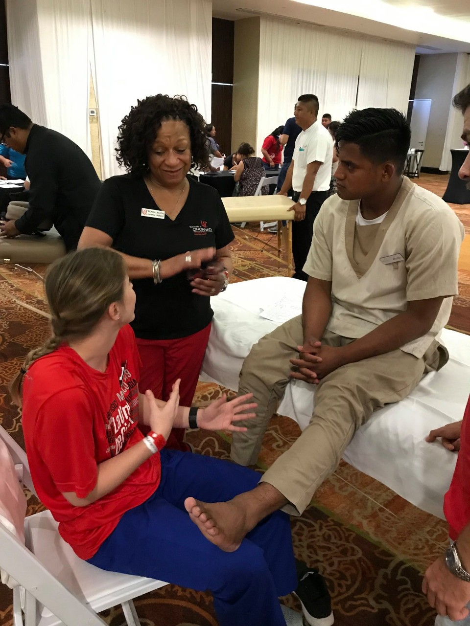 Student and staff help a paitent in Mexico